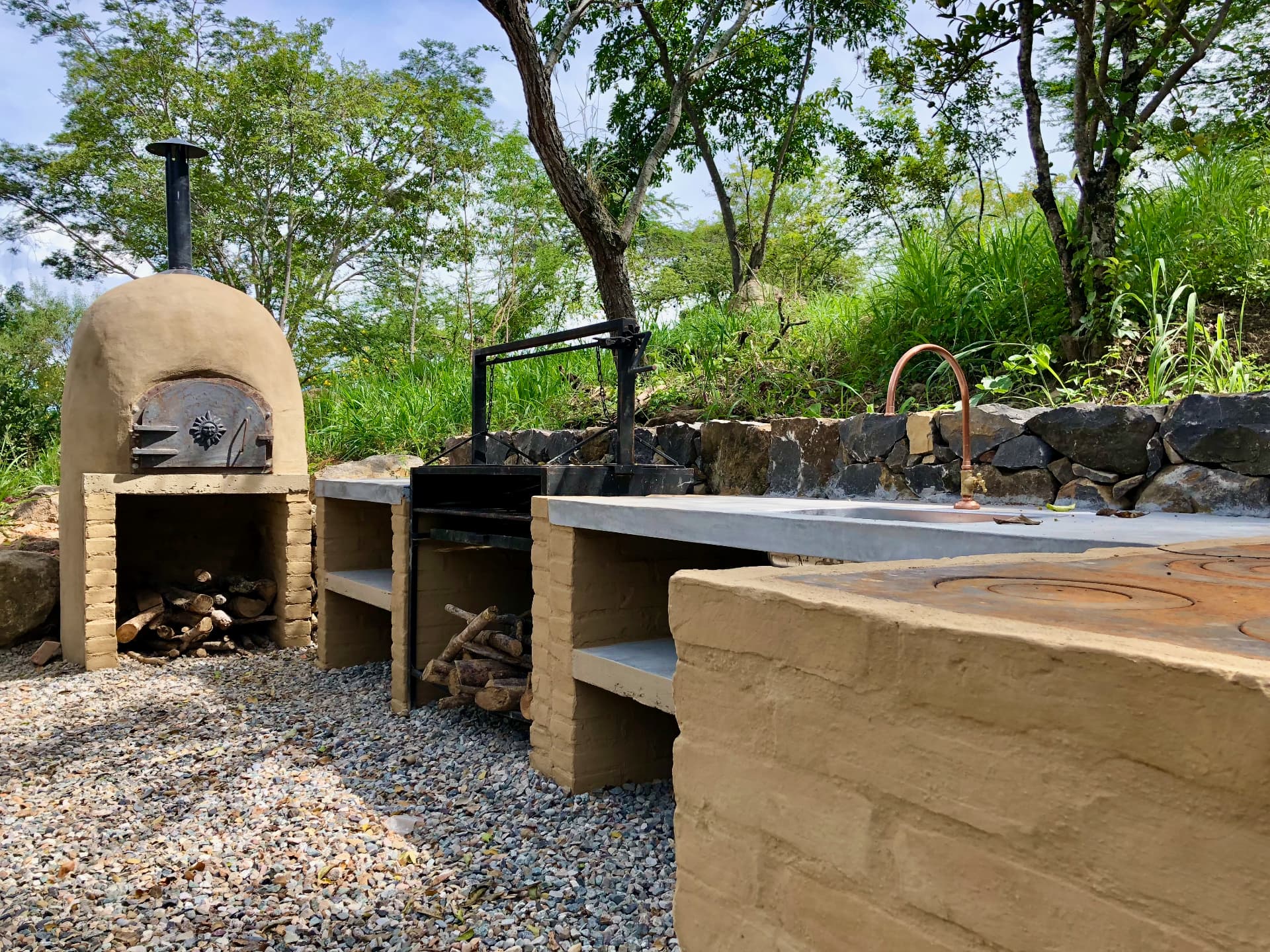 Adobe wood-fired oven, grill and concrete prep counter