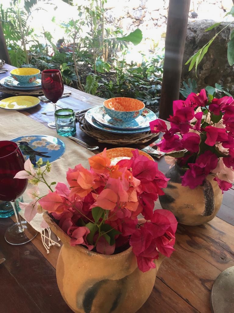 Table setting with bougainvillea in clay pots